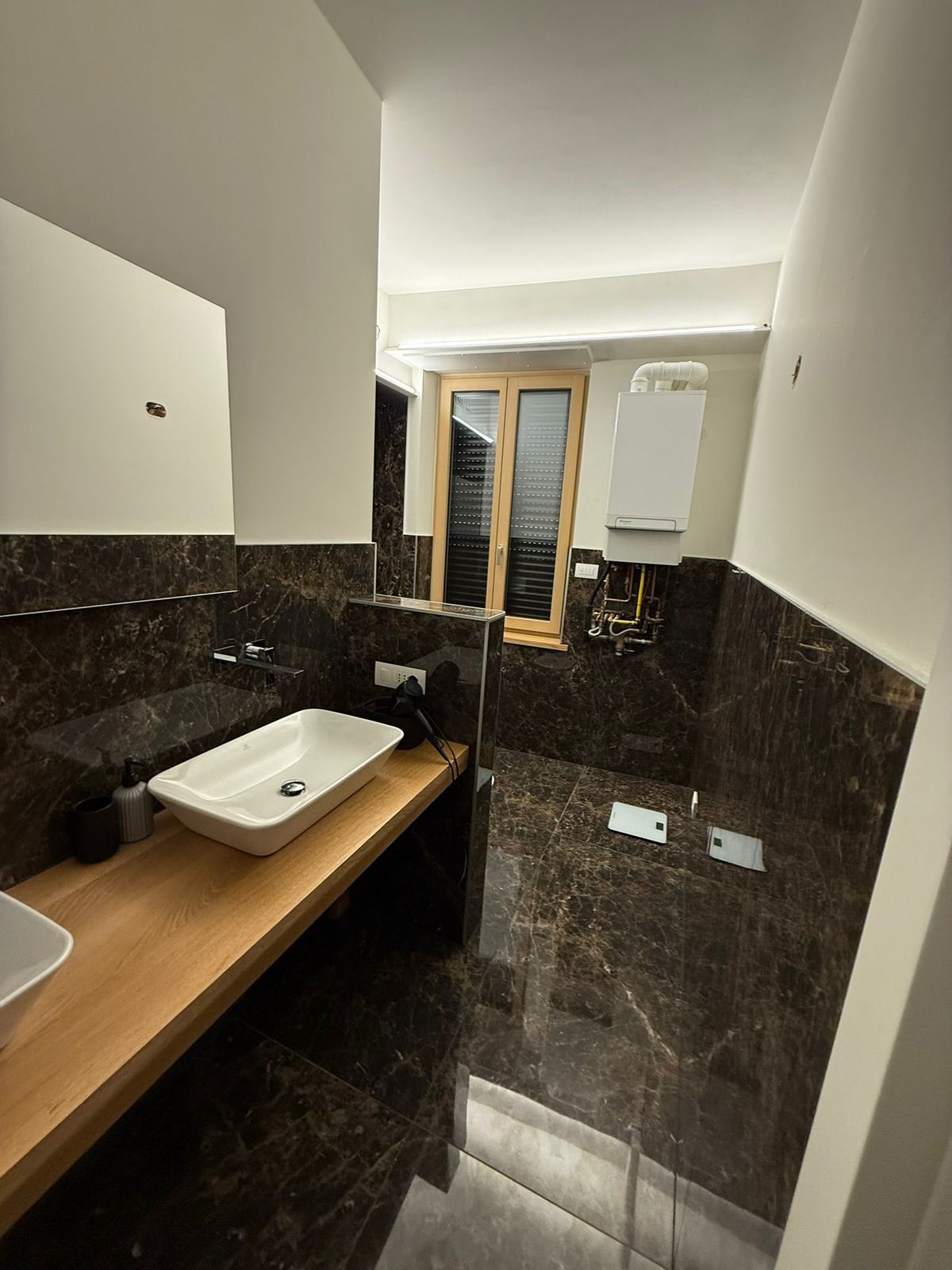 Bagno con impianto idraulico realizzato da Nova Build a Verona